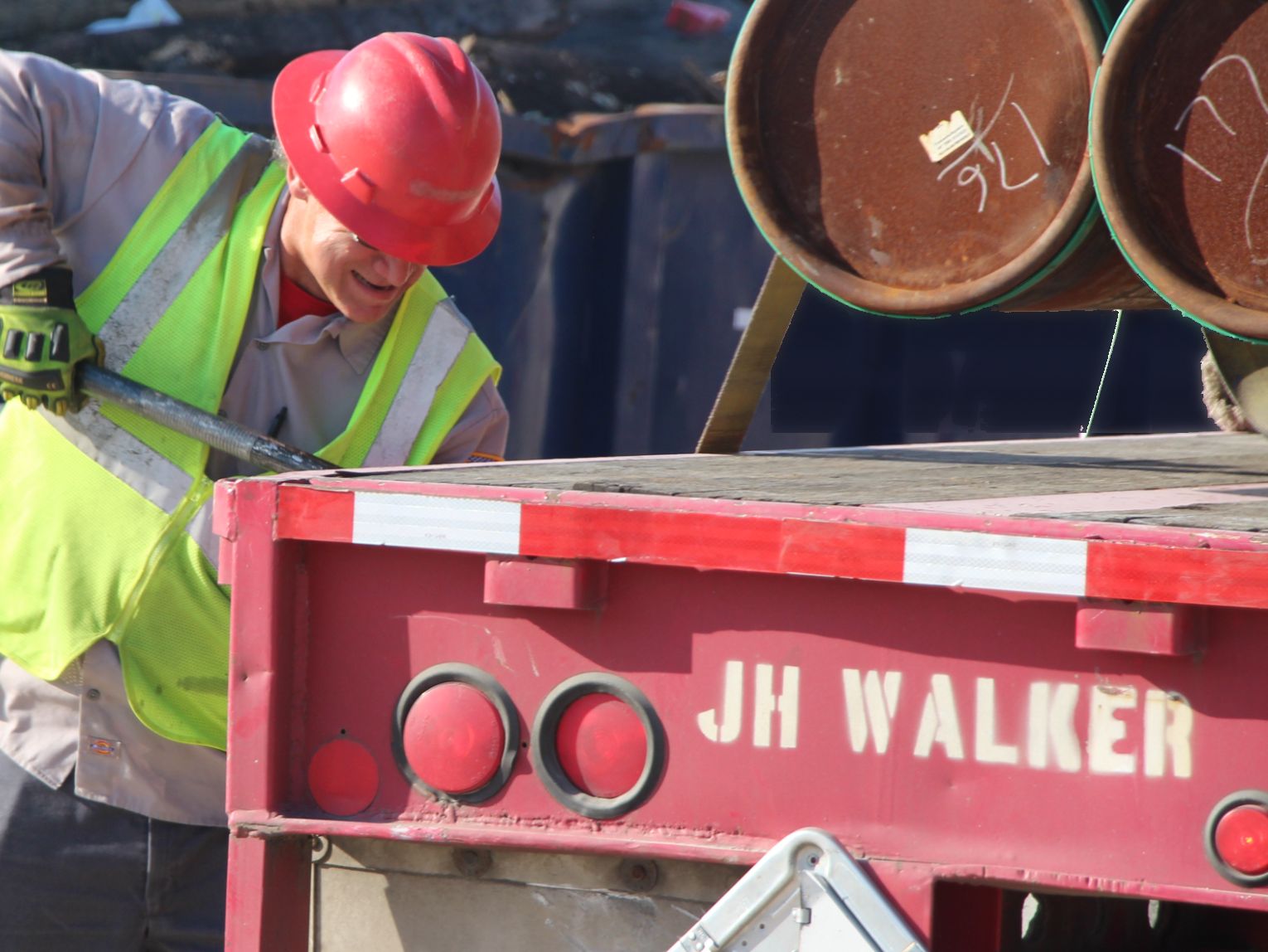 Superior driver securing a load on a J.H. Walker trailer